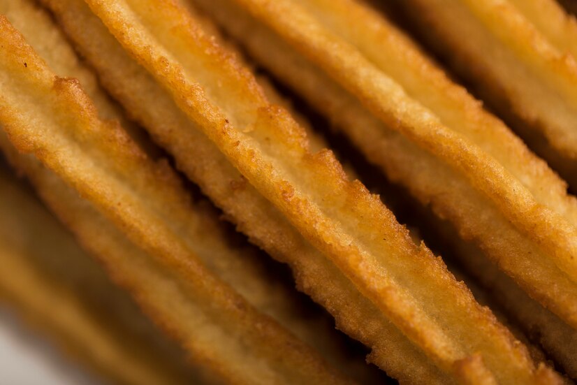 Churros are fried dough sticks covered in sugar