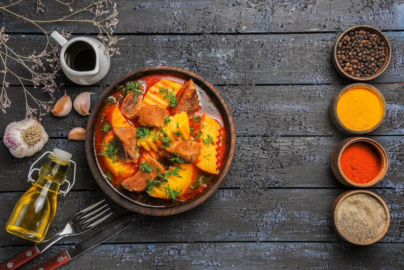 Add coconut fish curry to a bowl with rice and lime powder.